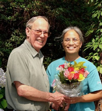Photo of Harold Schiffman presenting flowers to webmaster and web site designer Elsa Leslie upon completion of the web site. www.haroldschiffman-composer.com. Tallahassee, Florida (25 June 2006)