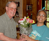 Photo of Harold Schiffman presenting flowers to webmaster and web site designer Elsa Leslie upon completion of the web site. www.haroldschiffman-composer.com. Tallahassee, Florida (25 June 2006)