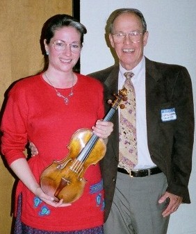 Photo of violinist Rebekah Binford and composer Harold Schiffman, following her première of his Sonata for Solo Violin (1993), Southeastern Composers' League 1998 Festival of New Music. Rowe Recital Hall, University of North Carolina at Charlotte (26 March 1998)