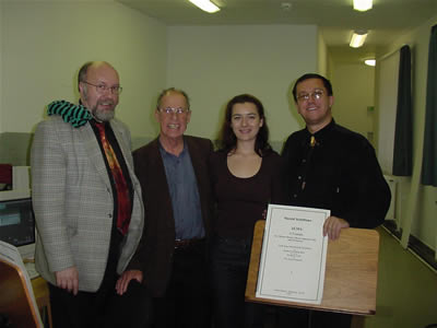 Photo of Harold Schiffman with the recording and technical staff for Alma:  (L to R) recording engineer István Biller, composer Harold Schiffman, interpreter and translator Szidónia Juhász, recording producer in Hungary, David Zsolt Király (President, Kiraly Music Network). Backstage at Janos Richter Hall, Győr, Hungary (22 October 2002)