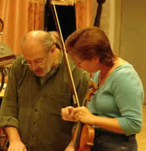 Photo taken two days before recording, conductor Mátyás Antal and violinist Rebekah Binford discuss the score. Budapest, Hungary (19 September 2007)