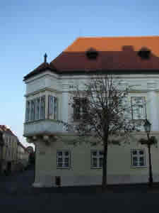 Photo of the Altabak house (Altabak-ház) faces the square shared with the Carmelite Church.  This square (Bécsi kapu tér), with its venerable and graceful houses, reflects Győr's long history as a center of culture. Győr, Hungary (20 September 2007)