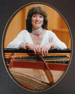 Photo of Jane Perry-Camp on stage, after the première of the Chamber Concertino for Piano and Double Wind Quintet (1985); Opperman Music Hall, The Florida State University, Tallahassee, Florida. (3 April 1986) Photograph by  Dixon Withers-Julian Photography; © 1986 Dixon Withers-Julian Photography