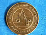PPhoto of the back of the medal that was given to Harold Schiffman in 2001, when he was designated an Honorary Visitor of the City of Győr.