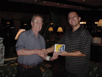 Photo of presentation of completed CD (Alma, Prelude and Variations, and Chamber Concerto No. 2) to Harold Schiffman by recording producer David Zsolt Király (President Kiraly Music Network). Budapest, Hungary (19 June 2003)