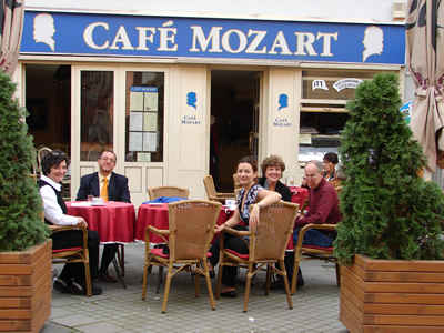 Friends and their composer gathered at Győr's Mozart Café for "snacks" after Alma's rehearsal (L to R) Connie Kotis, Dávid Zsolt Király, Szidónia Juhász, Judi Howle, Harold Schiffman [and unidentified patron of the restaurant]. Győr, Hungary (15 October 2008)