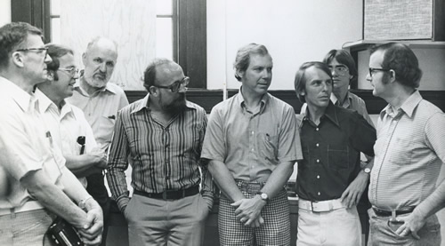 Krzysztof Penderecki (fourth from the left) met with resident composers and students during his visiting professorship at Florida  State University's School of Music.  Harold Schiffman (second from the  left) was Penderecki's special assistant during the visiting professorship. Tallahassee, Florida (Spring 1975) Photographer unknown