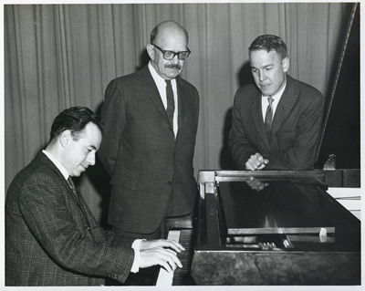 Roger Sessions (center), with whom Harold Schiffman had studied, was the guest composer for the Florida Composers League's meeting at Florida State University, where he is seen here with Leonard Mastrogiacomo (left) who performed Sessions' second piano sonata at the meeting -- and who two years earlier had premièred the Sonata No. 1 for Piano (1951) of Harold Schiffman (seen at the right). Tallahassee, Florida (16 March 1963) Photograph by Ken Richards of the FSU News Bureau