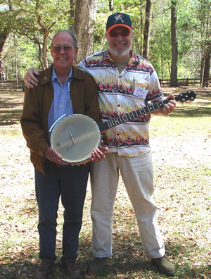 "Going for gold!"  Winner of the Suwannee Banjo Camp's silent auction, Harold Schiffman is joined by SBC faculty member and Gold Tone artist Bob Carlin – with Harold's newly won Gold Tone banjo. Suwannee Banjo Camp, O'Leno State Park, Florida (22 March 2009)