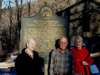 Photo of Soprano Gayle Seaton, composer Harold Schiffman, pianist Jane Perry-Camp at Georgia's Blood Mountain, with the State of Georgia's official marker describing the historical events that took place there (20 February 2010) [Photographer unknown]