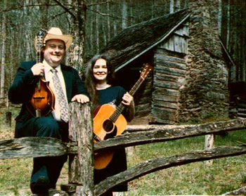 Photo of Bill and Wilma Millsaps at the Stewart Cabin on Big Santeetlah.  Wilma's great (4X) uncle, Arch Stewart, built this cabin in the 1800s. Photograph by Janet Ward